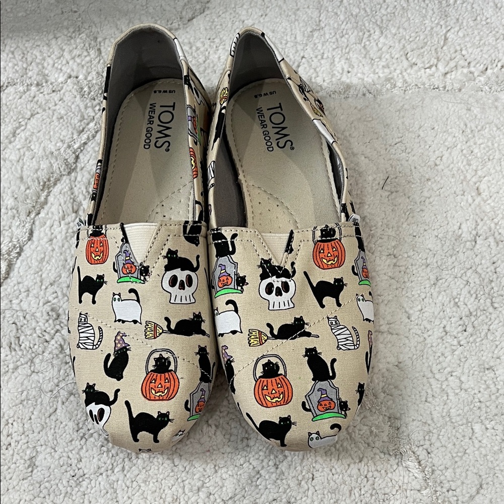 TOMS Beige Halloween Canvas Slip-Ons with Black & Orange Accents